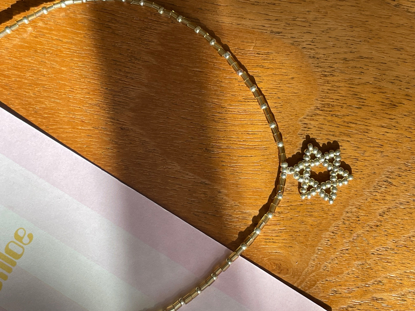 Gold Beaded Magen David necklace